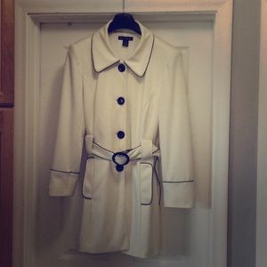 Belted Ivory jacket with piping and fully lined.